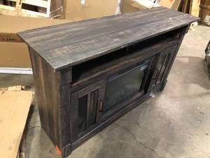 lot 6 image: SAUDER  60 in. W Carbon Oak Rectangle Engineered Wood TV Console with Fireplace. Customer Returns See Pictures