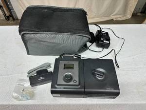 lot 76 image: MSRP $1800 Philips Respironics REMStar Auto System One A-flex CPAPBiPAP - Includes Travel Bag, Card, Power Supply & Reservoir Great Working Condition Only 7700 Total Hours - 1st Pic Is A Stock Pic - No Mask & Hose Included