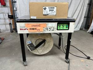 lot 37 image: MSRP $1200 StraPack&nbspD-53X&nbspSemi Automatic Strapping Machine Plus New Polychem MA3830 Flexband Strapping Banding - In Good Working Condition  See Youtube For How This Great Working Pre-owned Machine Works
