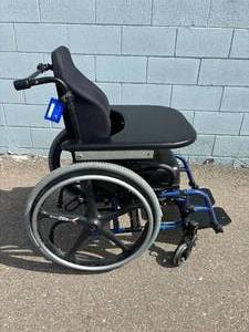 lot 5 image: MSRP $4000 QUICKIE&nbsp2 Most Sought-after&nbspFolding Ultra Lightweight Manual Wheelchair Comes With Extra Thick Back & Seat Cushions, X-Core Wheels, Removable Tray & Anti-tippers Great Condition Approx 14 Seat Width