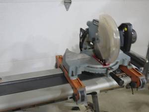 lot 53A image: Delta 10 Compound Miter Box Saw on A Ridgid Saw Stand