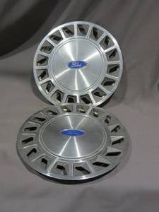 lot 76 image: Vintage Ford Hub Caps