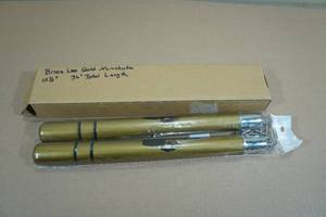 lot 167 image: Bruce Lee Gold Nunchucks