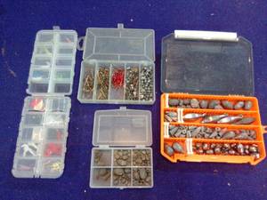 Four small tackle boxes with contents