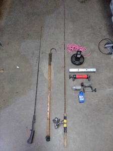 Vintage golden rod with Zebco reel, Berkeley Wrangler Rod, antique fishing gaff, small anchor and lights