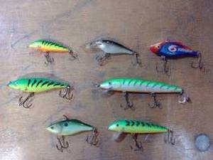 Seven assorted fishing lures Rapala, heddon, other