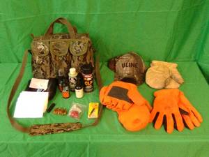 Canvas shooting bag with gun cleaning supplies hats and gloves