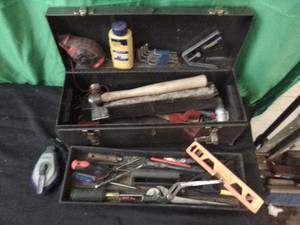 Toolbox full of assorted hand tools