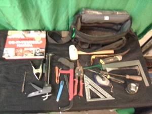 Tool bag full of assorted hand tools