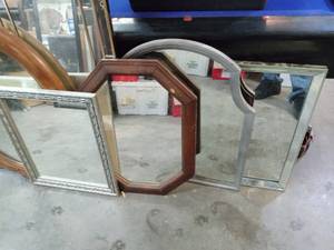 large assortment of framed mirrors
