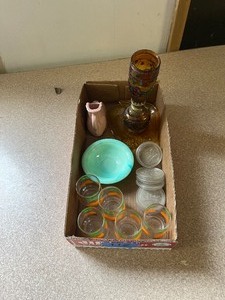 Juice glasses. mason jar lids, oil lamp