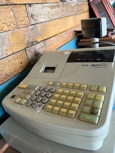 Cash register, coal shovel and guitar