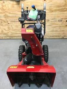 lot 150 image: Toro 24 in. Power Max Two-Stage Snow Blower with (2) 6.0Ah Batteries and Charger Model # 39924 (Outdoor Display Model) (retail $1899)