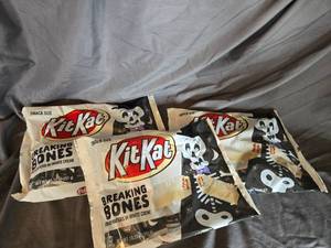 lot 40 image: 3 bags of KitKats white chocolate Best By 122024