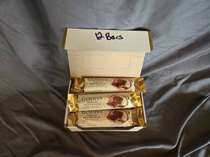 lot 12 image: Godiva milk chocolate and caramel filled candy bar Box of 12 Best By May 2024