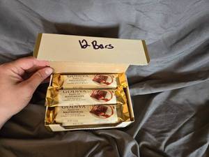 lot 13 image: Godiva milk chocolate and caramel filled candy bar Box of 12 Best By  May 2024