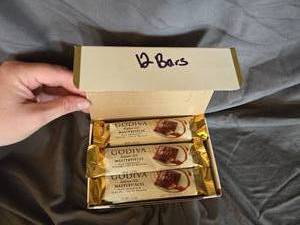 lot 14 image: Godiva milk chocolate and caramel filled candy bar Box of 12 Best Best By May 2024
