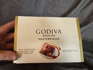 lot 15 image: Godiva milk chocolate and caramel filled candy bar Box of 12 Best By   May 2024