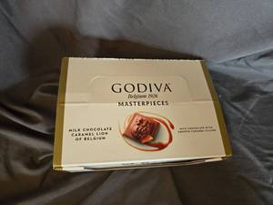 lot 16 image: Godiva milk chocolate and caramel filled candy bar Box of 12 Best By May 2024