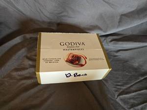 lot 17 image: Godiva milk chocolate and caramel filled candy bar Box of 12 Best By May 2024