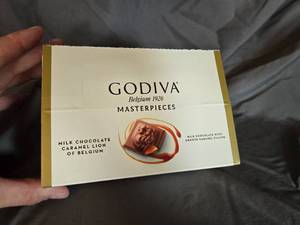 lot 18 image: Godiva milk chocolate and caramel filled candy bar Box of 12 Best By May 2024