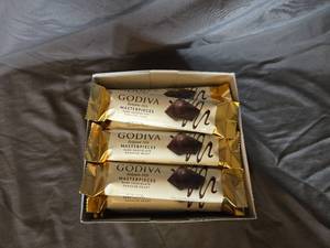 lot 19 image: Godiva dark chocolate and ganache filled candy bar Box of 24 bars Best By April 2024