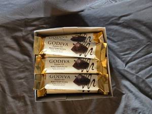 lot 21 image: Godiva dark chocolate and ganache filled candy bar Box of 24 bars Best By April 2024