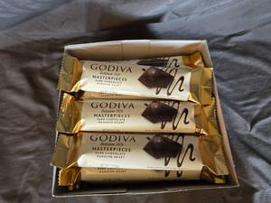 lot 24 image: Godiva dark chocolate and ganache filled candy bar Box of 24 bars Best By April 2024