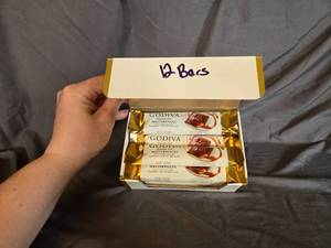 lot 11 image: Godiva milk chocolate and caramel filled candy bar Box of 12 Best By May 2024