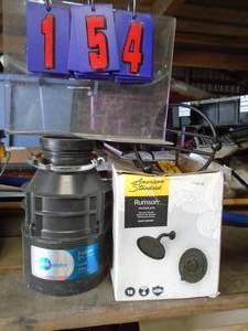 Insinkerator & shower parts. As shown.