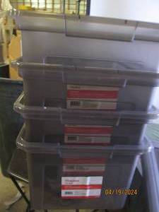 4 plastic file boxes with covers...