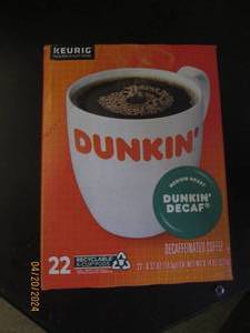 package of dunkin decaf 22 pods in package best by date of august 2024