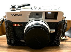 Two Canon Cameras and Flash Accessories