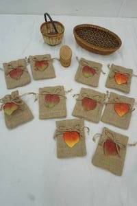 lot 36 image: 2 small wicker baskets, small woodbox and 10 small harvest bags