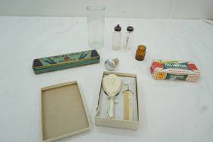 lot 38 image: Vinage Baby Bottles, vintage pencil case, soap, vintage babay brush and comb, wine stopper