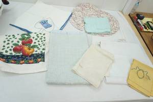 lot 40 image: Linens, placemats, vintage baby blanket,