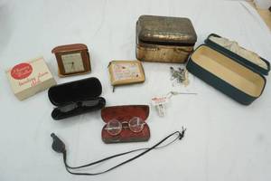 lot 42 image: Vintage eyeglasses, vintage Plinney Walker Travel Clock, vintage tin, wallet and more
