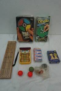 lot 71 image: Vintage Games, Pocket Simon, Little Professor, Puzzels, Super Balls, and Pocket Othello games