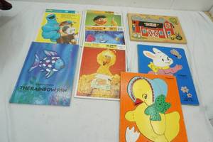 lot 131 image: Kids Puzzels, Cookie Monster, Big Bird, Aladdin and more