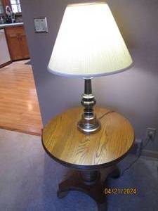 lot 12 image: Brass toned table lamp with stunning round solid Wood end table