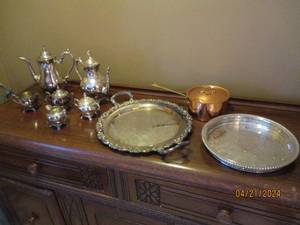 lot 21 image: Oneida silver plated tea set with pitchers, cups and other serving pieces