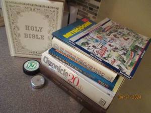 lot 44 image: Bundle of Vintage Medical books, Holy Bible, North Stars hockey puck and a heavy metal puck shaped paper weight