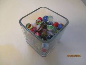 lot 91 image: Small glass vase containing a variety of vintage marbles