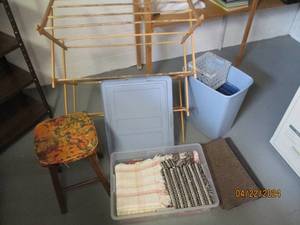 lot 99 image: Wood drying rack, stool, garbage cans and tote of rugs