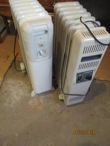 lot 135 image: Pair of oil filled electric space heaters