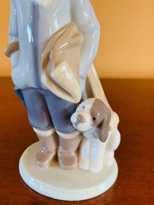 lot 61 image: LLADRO Winter Child Boy with Dog