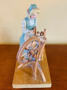 lot 62 image: Vintage Folk Art Hand Carved Wood Woman at Spinning Wheel