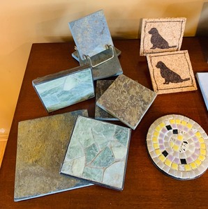 lot 66 image: Variety of Coasters and Paw Print Trivets