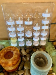 lot 71 image: Wax and Battery Operated Candles for All Occasions with Candle Holders and Pretty Tray with Rocks