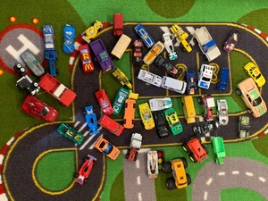 lot 83 image: Assortment of Matchbox Cars, Other Various Toy Vehicles and Rug
